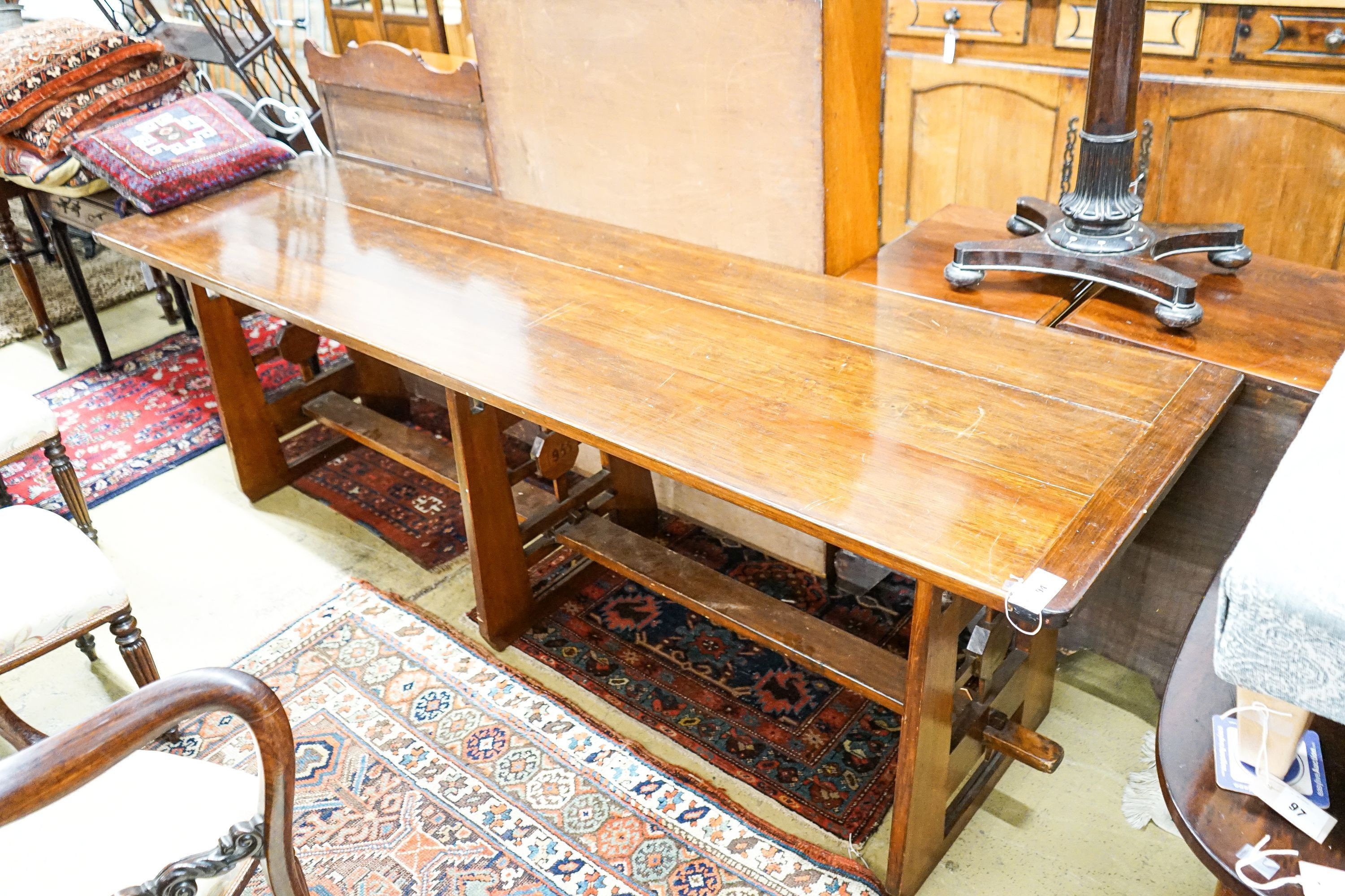 A mid 20th century Arts and Crafts style rectangular pine and beech serving table, dated 1955, length 245cm, depth 66cm, height 76cm